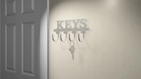 Zoom into a pair of house keys on a key rack Stock Footage 54454618