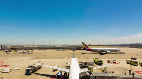 Zoom Pan Timelapse Ground Crew Loading Servicing Parked Airplane Airport Gate Stock Footage