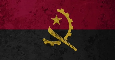 A zoom panning video of a worn out rusty wall with the angola flag Stock Footage 337426897