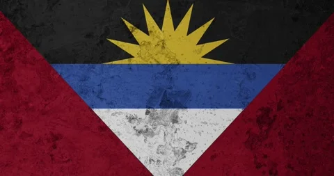 A zoom panning video of a worn out rusty wall with the antigua y barbuda flag Stock Footage 337426982