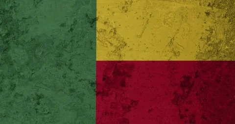 A zoom panning video of a worn out rusty wall with the benin flag Stock Footage 337427208