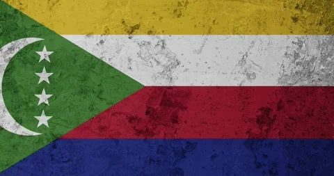 A zoom panning video of a worn out rusty wall with the comoros flag Stock Footage 337428081