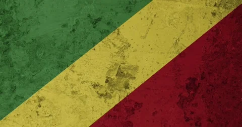 A zoom panning video of a worn out rusty wall with the congo republic flag Stock Footage 337428113