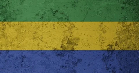 A zoom panning video of a worn out rusty wall with the gabon flag Stockbeeldmateriaal 337428695