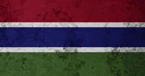 A zoom panning video of a worn out rusty wall with the gambia flag Video stock 337428709