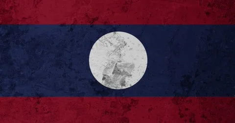 A zoom panning video of a worn out rusty wall with the laos flag Video stock 337429597