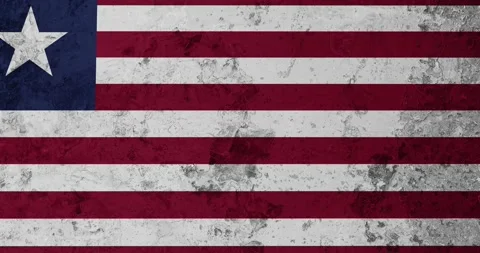 A zoom panning video of a worn out rusty wall with the liberia flag Видео 337429627