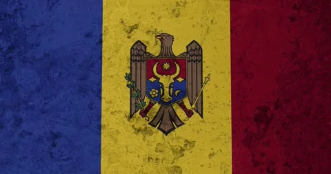 A zoom panning video of a worn out rusty wall with the moldova flag Video stock 337429816