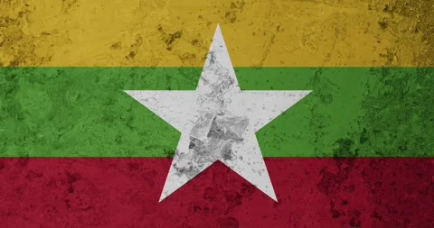 A zoom panning video of a worn out rusty wall with the myanmar flag Video stock 337429862