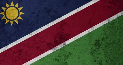 A zoom panning video of a worn out rusty wall with the namibia flag Stock Footage 337429871