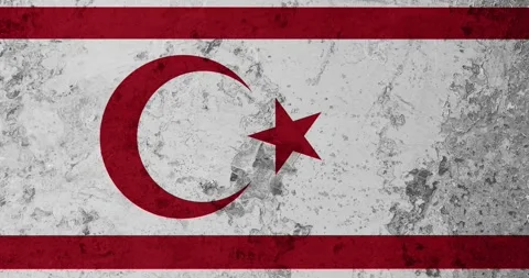 A zoom panning video of a worn out rusty wall with the northern cyprus flag Video stock 337429887