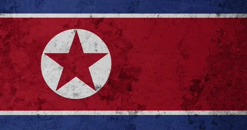 A zoom panning video of a worn out rusty wall with the north korea flag Video stock 337429988