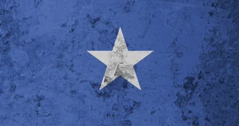 A zoom panning video of a worn out rusty wall with the somalia flag Video stock 337431378