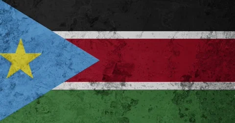 A zoom panning video of a worn out rusty wall with the south sudan flag Stockbeeldmateriaal 337432215