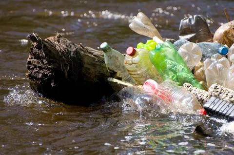Zoom on plastic garbage damage river after flood Stock Photos