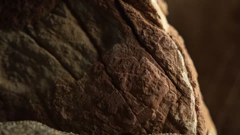 Zoom-in on reddish brown textured rock ridge details Stock Footage 312612730