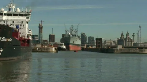 Zoom in of RFA Orangeleaf being towed into dock Stock Footage 67149