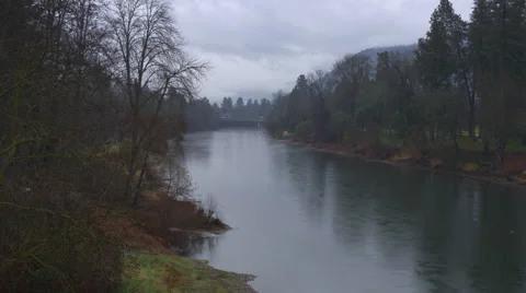 Zoom-in on Rogue River in the rain at Grants Pass, Oregon Stock Footage 59313991