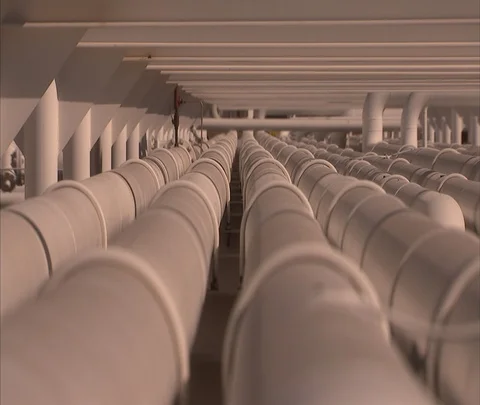 Zoom into rows of pipes at refinery Stock Footage 86748212