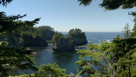 Zoom in on sea stacks at cape flattery in olympic national park Stock Footage 99673853