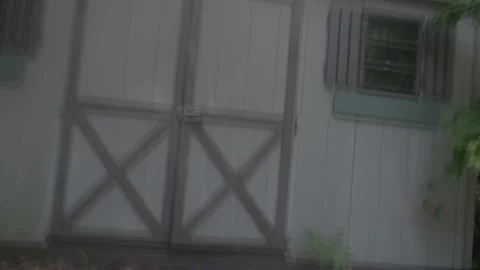 Zoom into Shed Opening Video stock 295313880