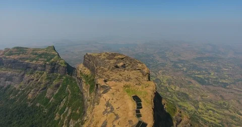 Zoom in shot of Ancient structure and rock cut water tank on top of mountain Stock Footage 116997796