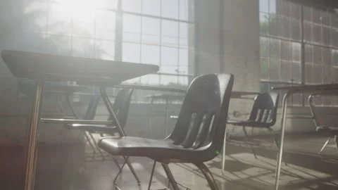 Zoom in shot of Empty Sunny Classroom with chairs and desks during day time Stock Footage 208797045