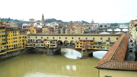 Zoom in shot of Ponte Vecchio bridge and Arno River in Florence Italy Stock Footage 89781385