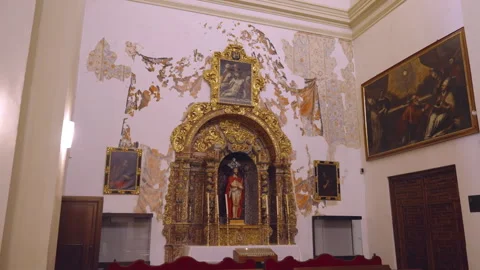 Zoom in shot of a statue of christ inside almudena cathedral of madrid Stock Footage 252639034