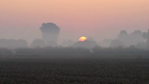 Zoom shot sun rises on a cold autumn morning. Panning. 4K video Video stock 141573168