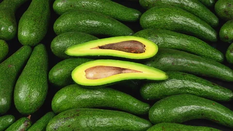 Zoom In Sliced Fresh Long Avocado Halves Background Close Up Stock Footage 336494076