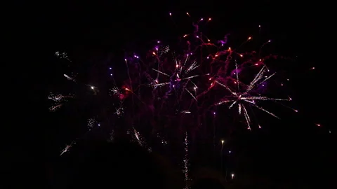 Zoom in slow motion colourful small fireworks with smoke trails Video stock 235226578