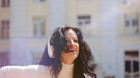 Zoom in smiling brunette dancing professionally on sunny day Stock Footage 119368838