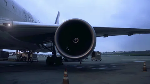 Zoom In of Spinning Jet Engine Turbine on Airport Tarmac in Rome - 4K Stock Footage 271155423
