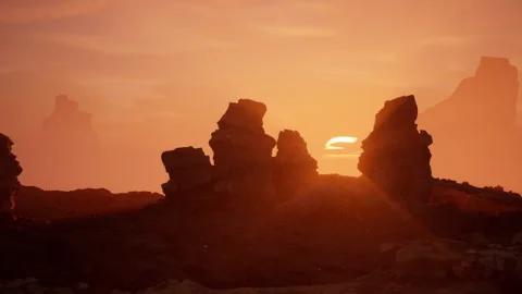 Zoom in on Sun Setting in Rocky Desert Stock-Footage 201348854
