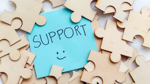 Zoom in support puzzle pieces and post- notes in a creative workspace Video stock 309747810