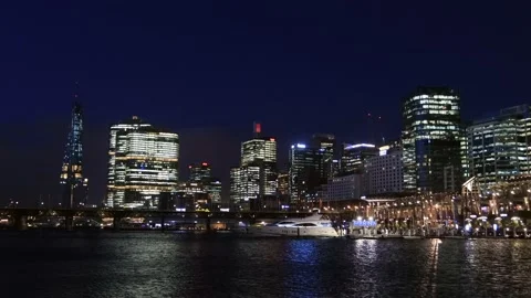 Zoom in to Sydney CBD waterfront of Darling harbour at dark blue hour – 4k. Stock Footage 143995514