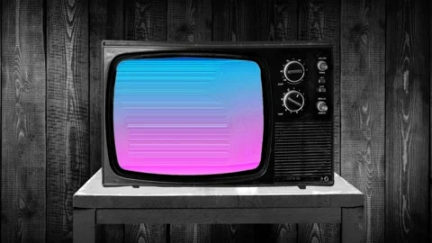 Zoom in then fixed shot on 70s televisor set, artistic neon pink-blue screen Stockbeeldmateriaal 119414231