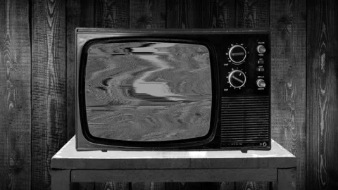 Zoom then fixed shot on a ancient television with static black and white sizzles Stock Footage 119415210