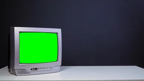 Zoom then fixed shot in a old tv set with green screen, compositing, chroma key Stock Footage 129673283