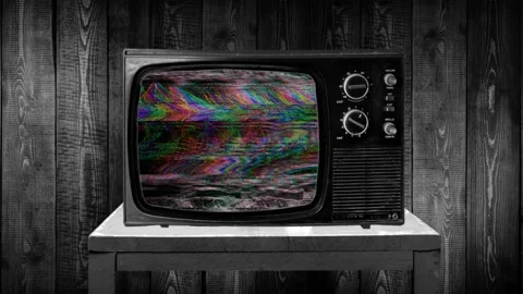 Zoom in then fixed shot on retro glitch TV static, spectral color reflection Stock Footage 119401130