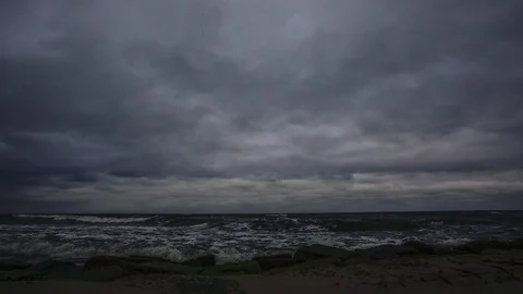 Zoom in time lapse of dramatic dark ocean rocky coastline sky clouds moving Stock Footage 119229287