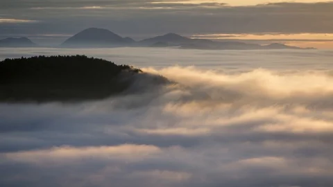 Zoom in time lapse inversion clouds rolling over forest hill Stock Footage 129092414