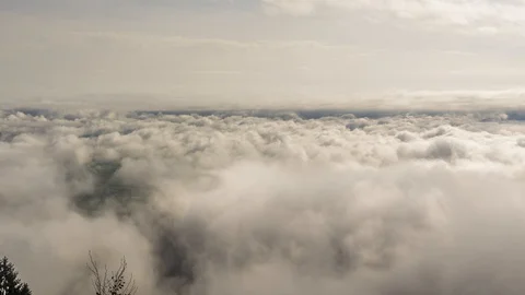 Zoom in time lapse sea of clouds from hilltop Stock Footage 128838155