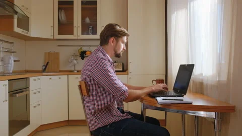 Zoom-in time lapses creative young man in freelancer casual clothes at home 스톡 동영상 140050121