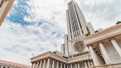 Zoom in timelapse of CL Building at Assumption University against cloudy sky Video stock 113349296