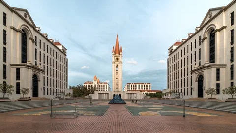 Zoom in Timelapse of Clock tower at ABAC being illuminated during sunrise Stock-Footage 111165564