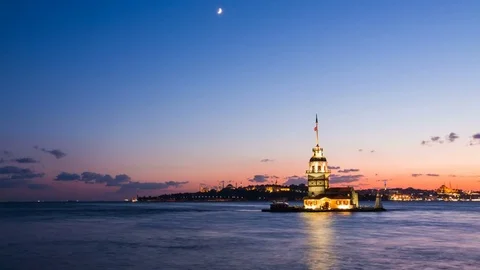Zoom in timelapse of Maiden Tower or Kiz Kulesi with floating tourist boats on Stock Footage 80302664