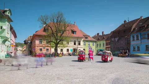 Zoom in Timelapse of People visiting the medieval old city center of Sighisoara Stock Footage 220157173