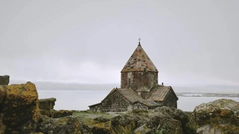 Zoom in Timelapse Sevanavank monastic complex building with Sevan lake. Pen.. Stock Footage 328877965